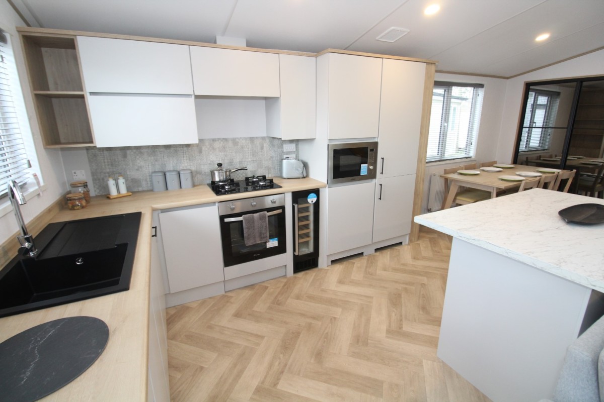 modern new kitchen in the 2023 Atlas Oakwood Lodge 