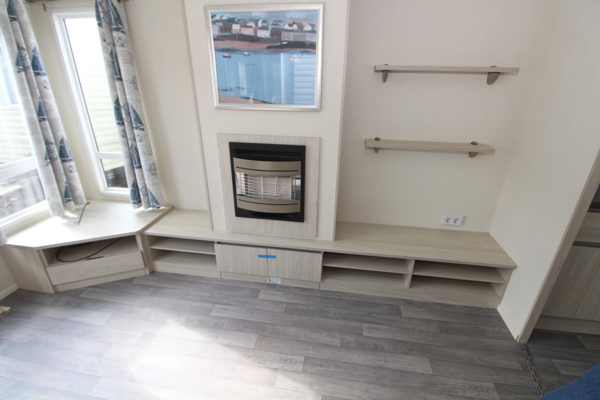lounge with tv area and fire