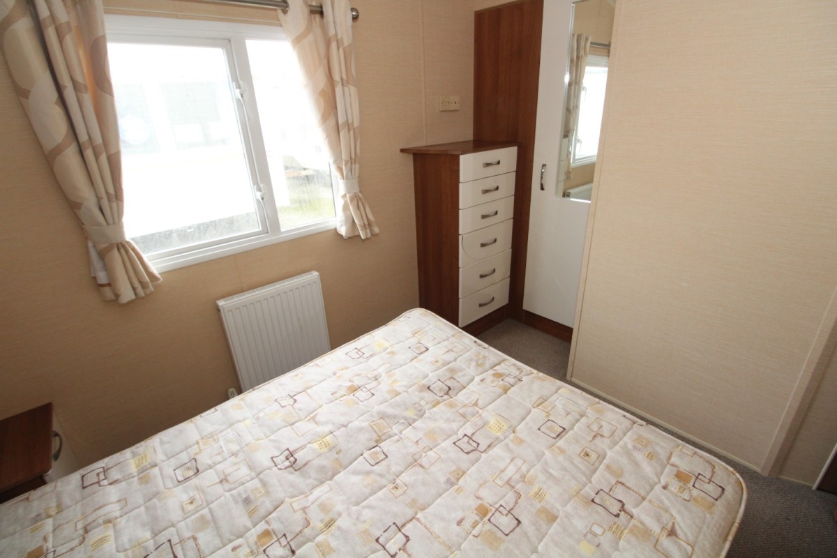 double bedroom with wardrobe and windows