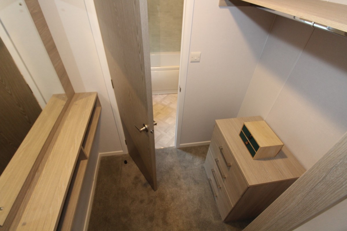 walk in wardrobe in the 2023 Atlas Wisteria Lodge