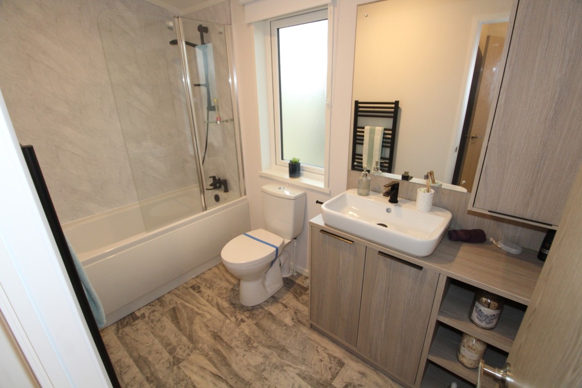 2023 Atlas Lilac Lodge family bathrooom with bath