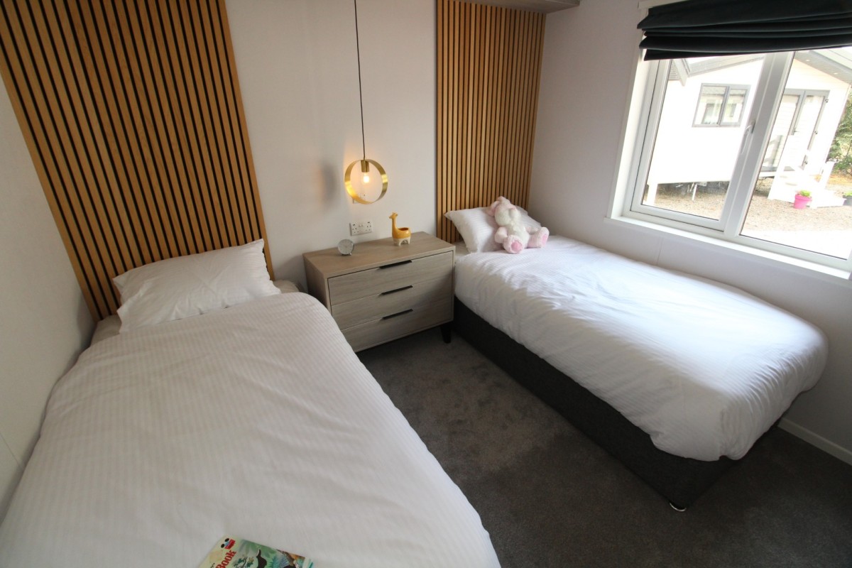 2023 Atlas Lilac Lodge twin bedroom