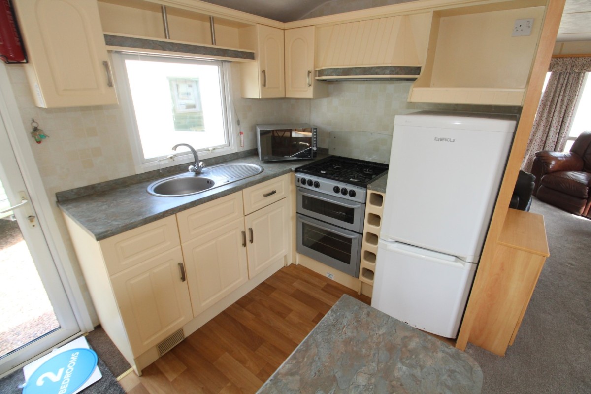 kitchen with fiull size fridge freezer in the 2007 Atlas Amethyst 