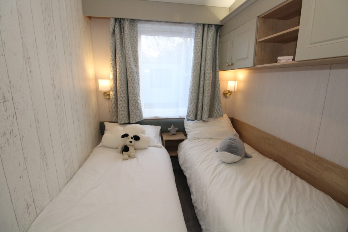 twin bedroom in the 2023 Swift Moselle Lodge 