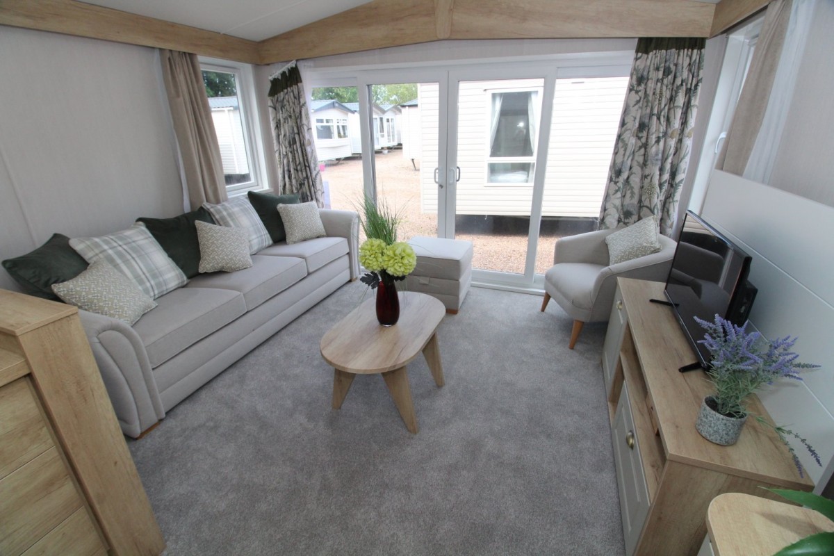 lounge to front doors in the 2023 Swift Moselle Lodge 