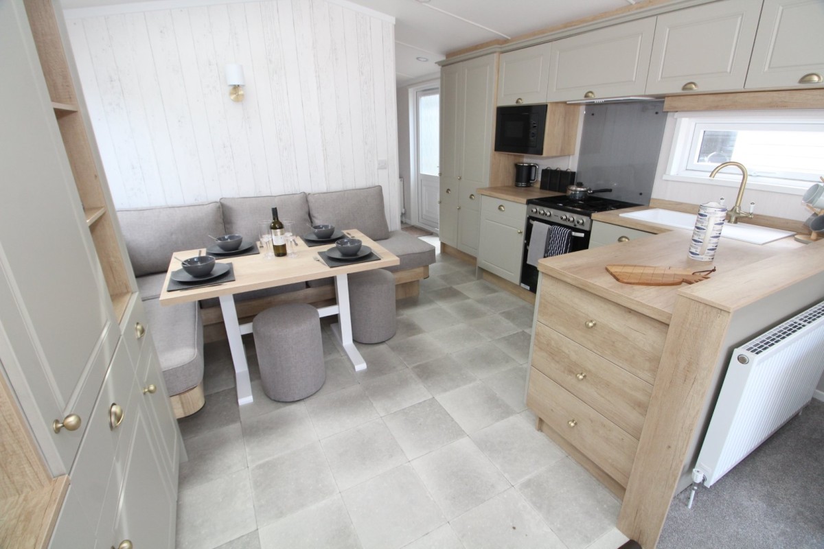 dining area and kitchen in the 2023 Swift Moselle Lodge 