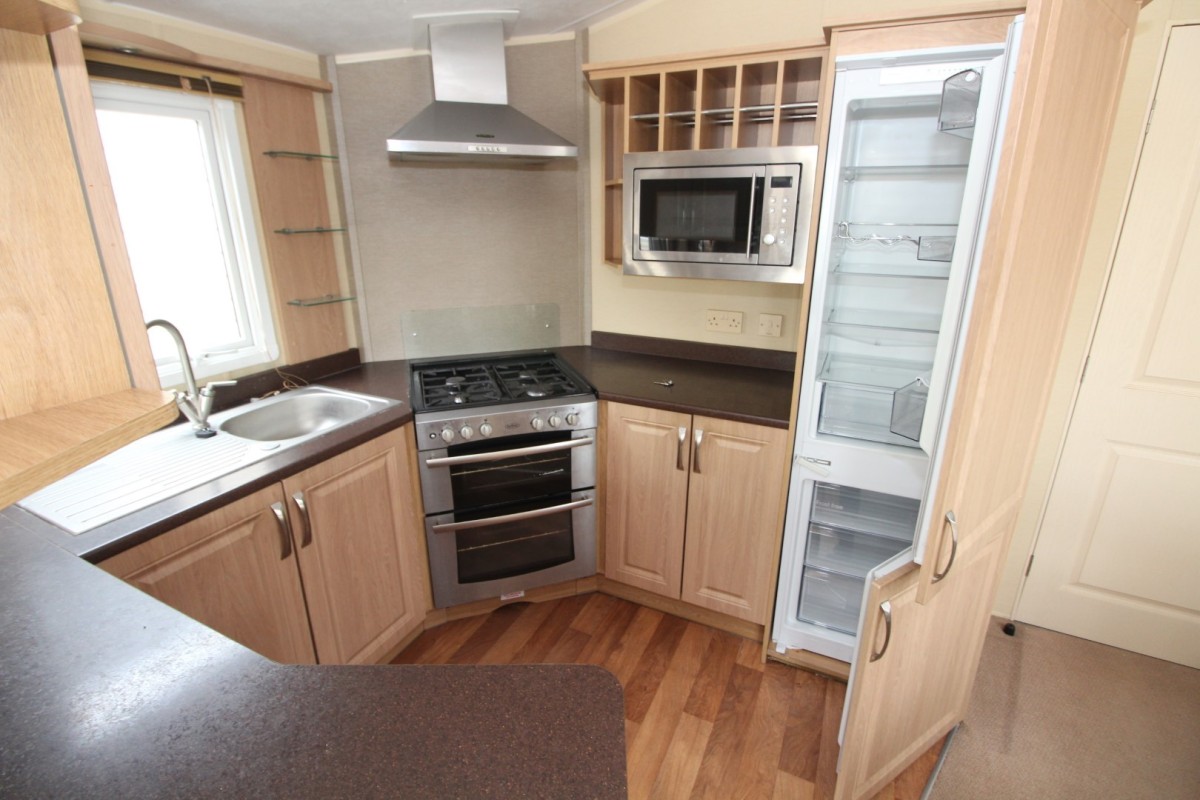 kitchen with full size fridge freezer in the 2012 BK Grosvenor static caravan