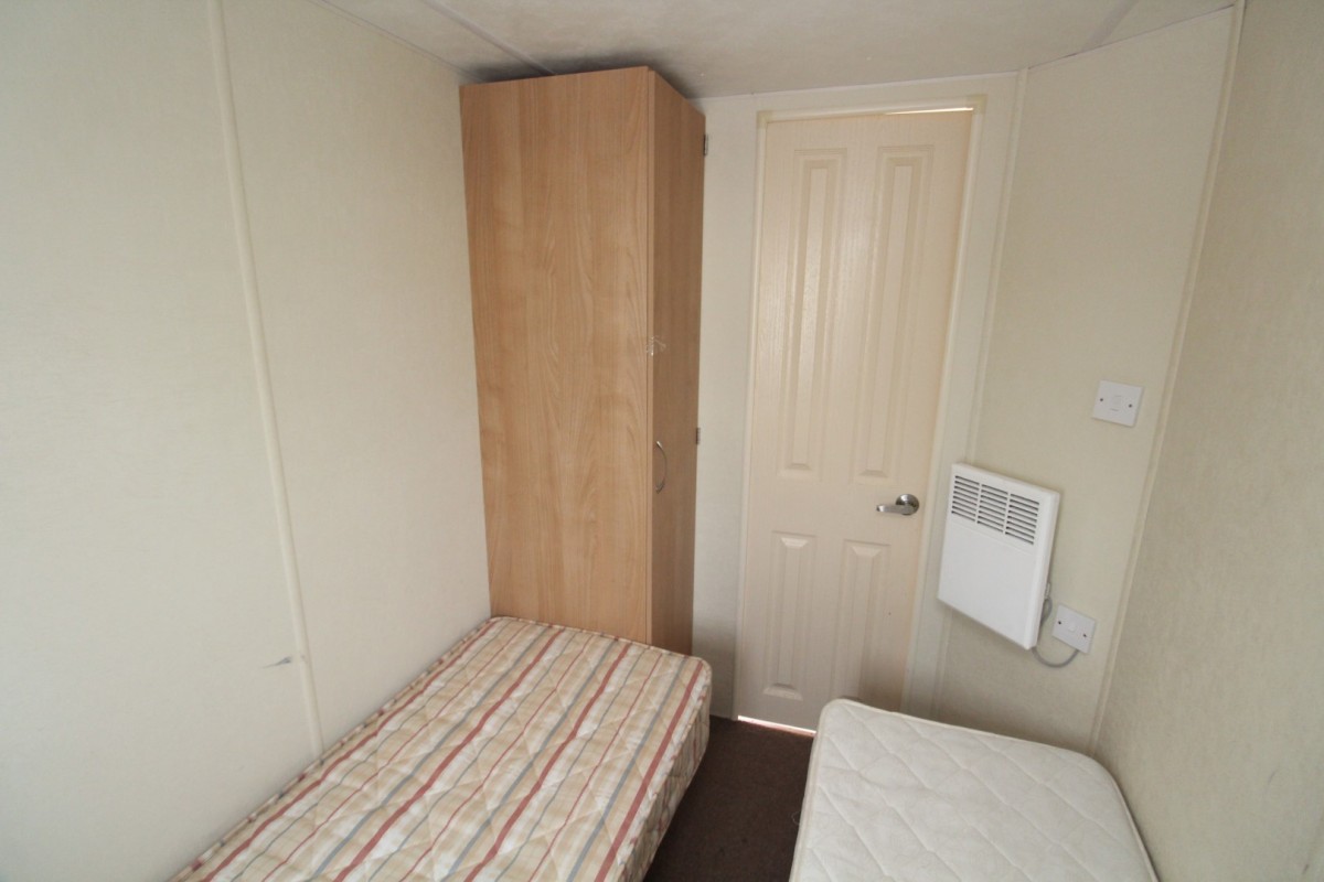 wardrobe in twin bedroom