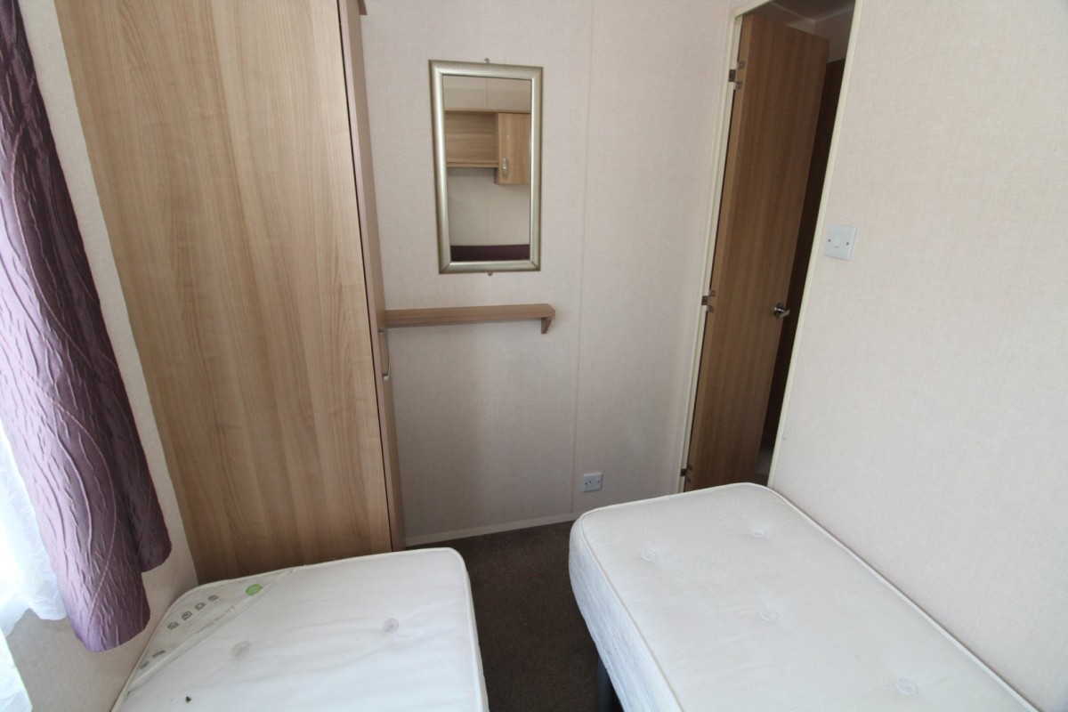 twin bedroom with wardrobes