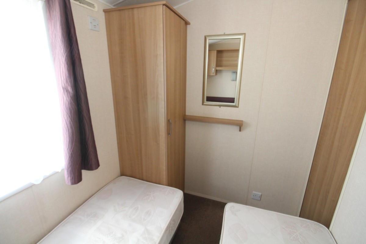 third bedroom with wardrobes