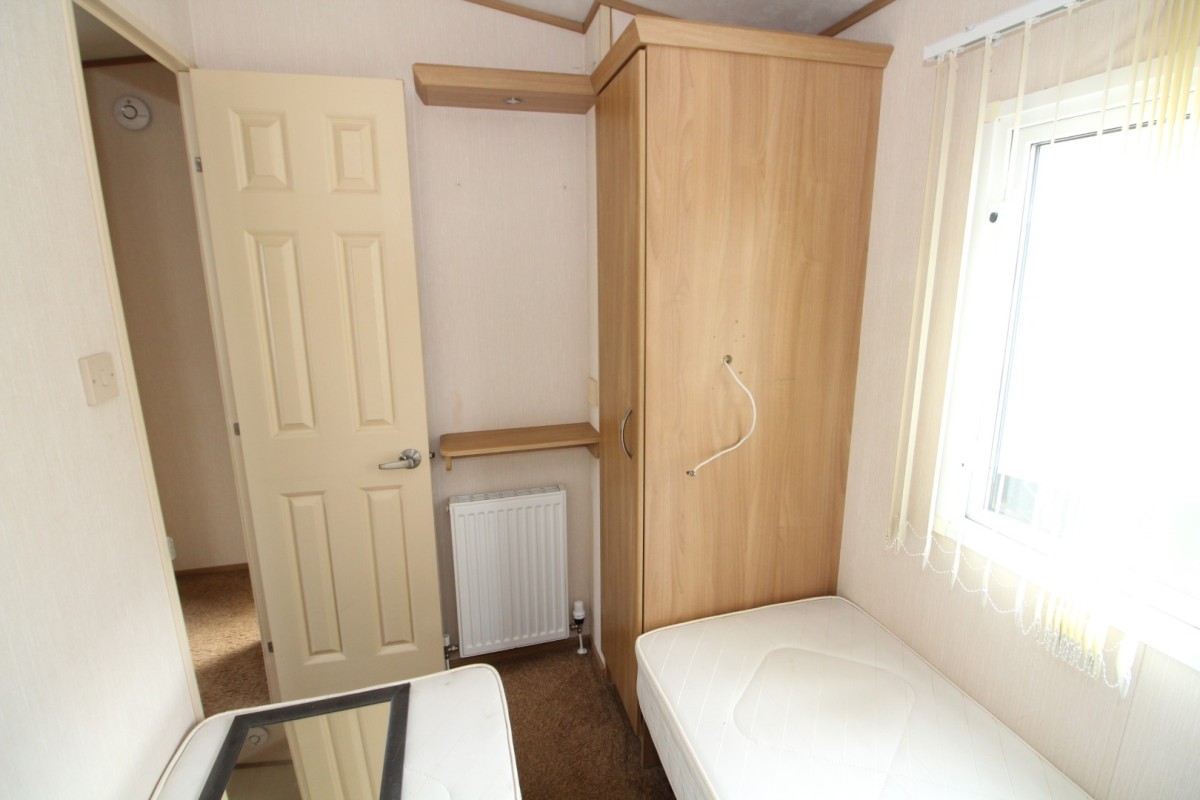 third bedroom with wardrobes