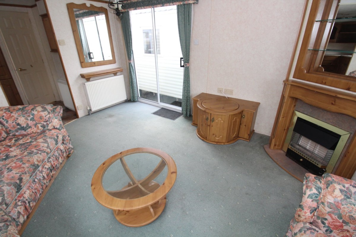 tv area by the doors in the 2002 Willerby Manor