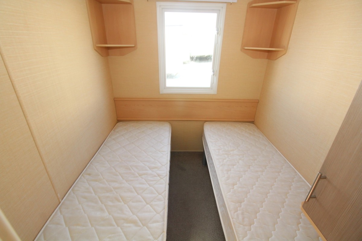 twin beds with cupboards