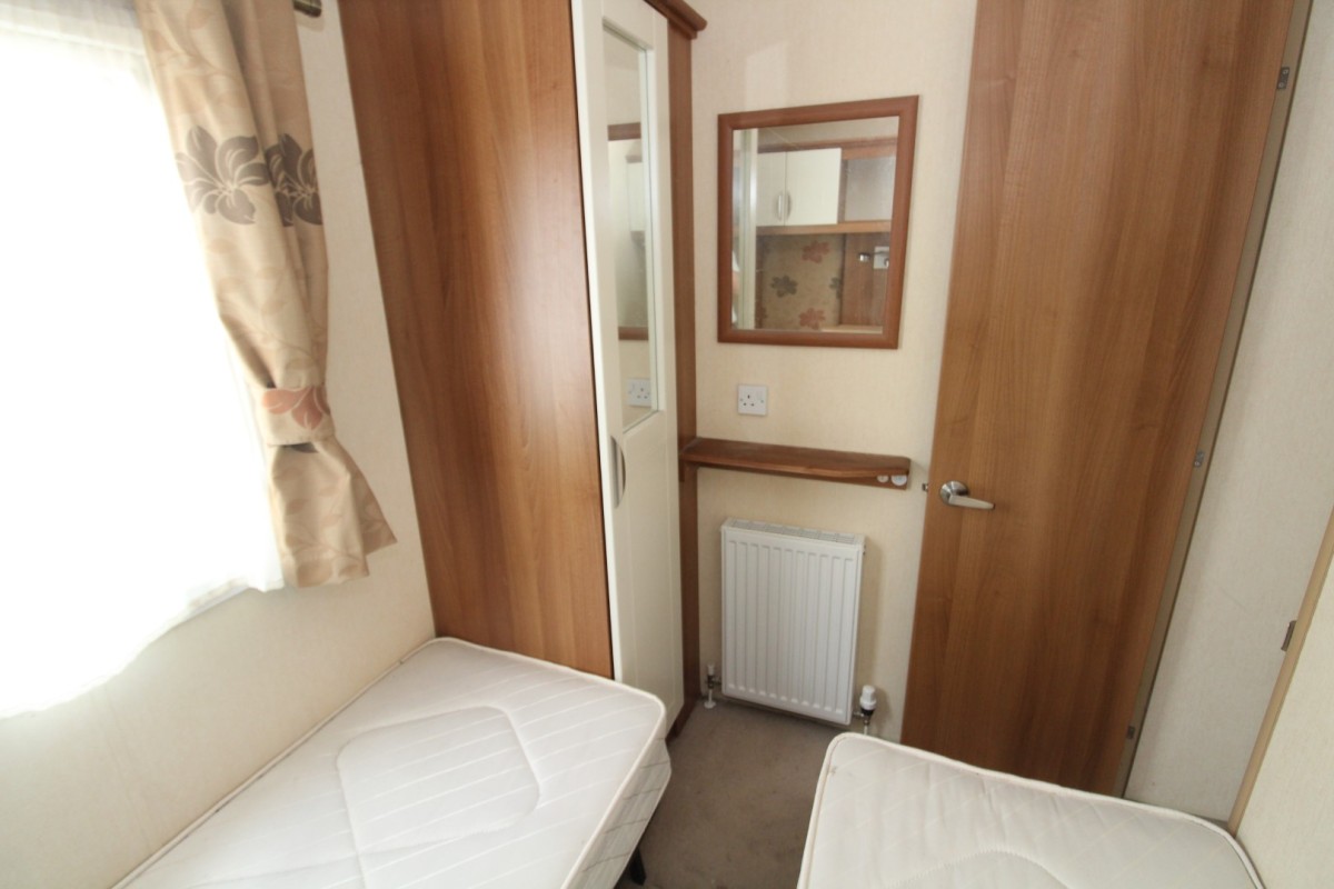 wardrobe and twin beds