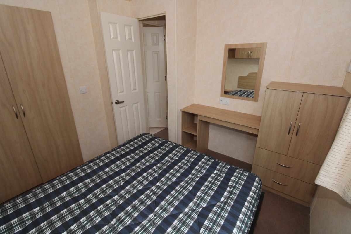 double bedroom with dressing table in the 2008 BK Contessa