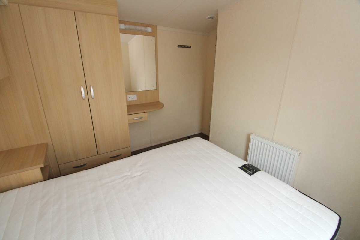 double bedroom with wardrobes in the 2012 Swift Burgundy