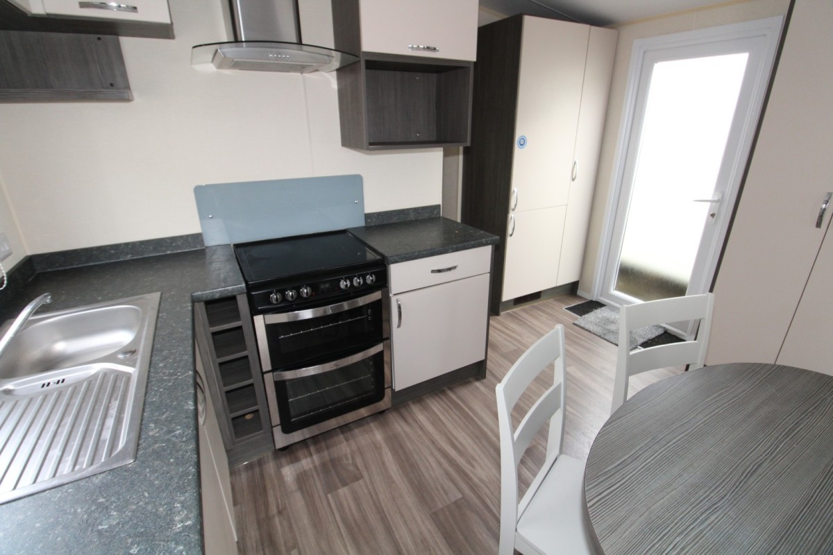 kitchen with oven to dining area in the 2015 Regal Henley