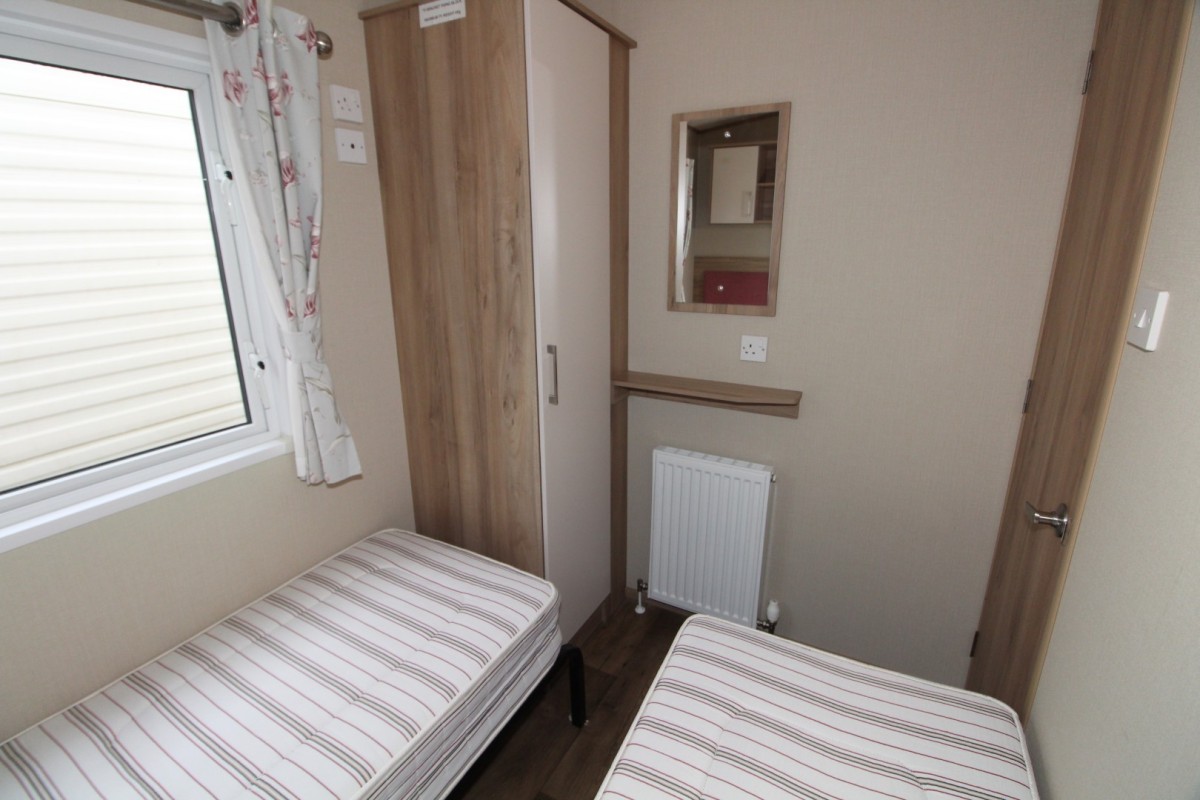 third bedroom with twin beds in the 2016 ABI Oakley