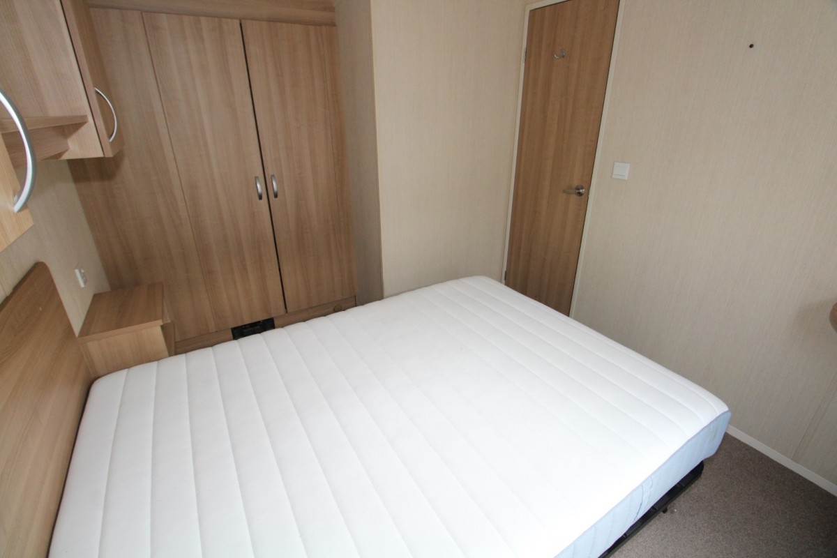 double bed with wardrobes in the 2014 Swift Burgundy