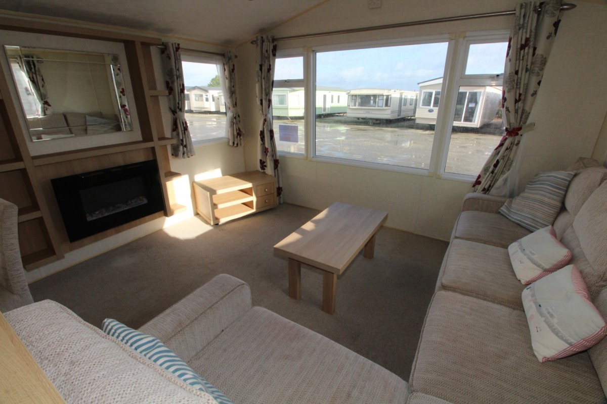 lounge with large front windows in the 2013 Willerby Avonmore