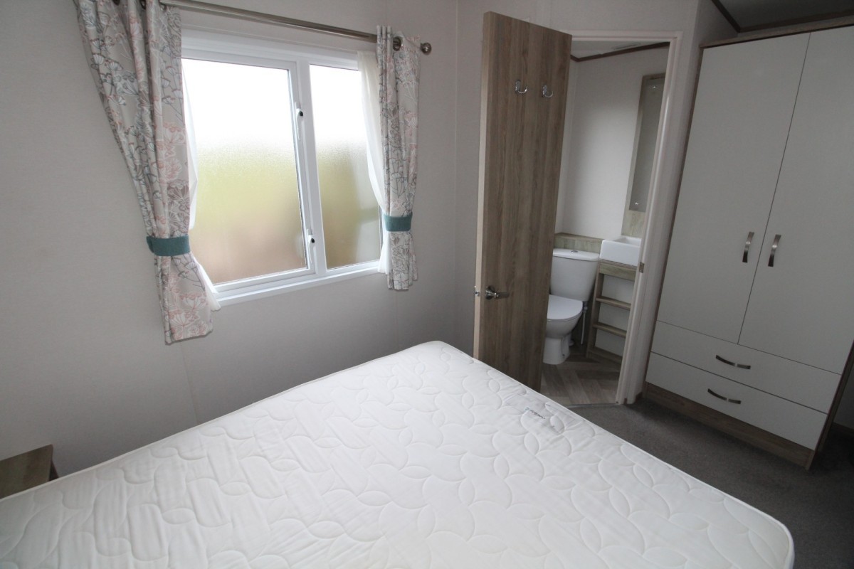 double bed by windows