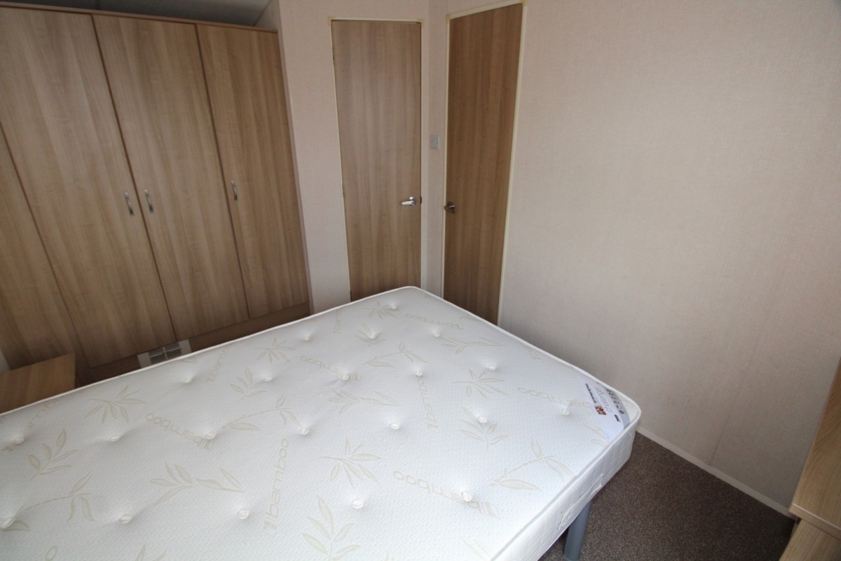 double bedroom with wardrobes in the 2011 Atlas Chorus