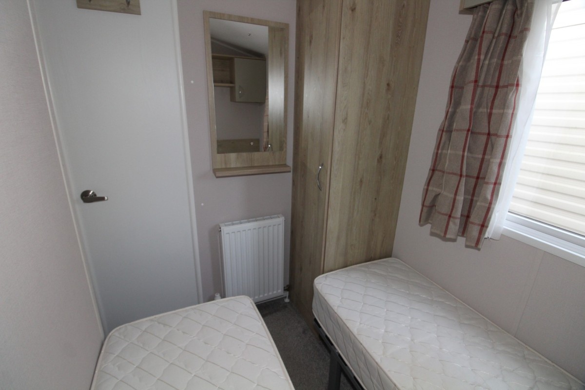 twin beds in the third bedroom in the 2021 Atlas Mirage 