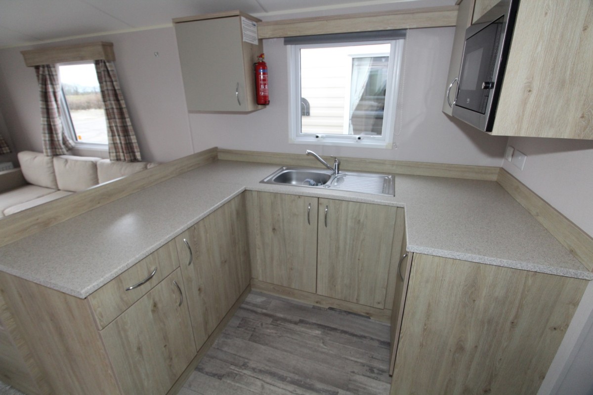 u shaped kitchen with cupboards in the 2021 Atlas Mirage 