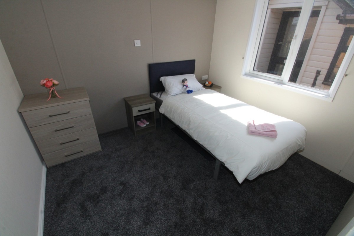 second bedroom in the 2018 Atlas Lilac Lodge