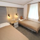 2023 Atlas Oakwood Lodgelarge twin bedroom