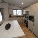 2023 Atlas Oakwood Lodge  dining area to kitchen