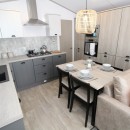 kitchen with dining area in the 2024 Atlas Sherwood Lodge