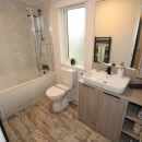 2023 Atlas Lilac Lodge family bathrooom with bath