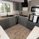 modern kitchen in the 2023 Atlas Lilac Lodge