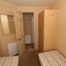 second view of the twin bedroom with cupboards