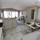 dining area to lounge in the 2023 Swift Moselle Lodge 