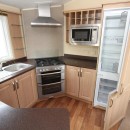 kitchen with full size fridge freezer in the 2012 BK Grosvenor static caravan