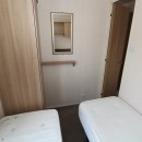 twin bedroom with wardrobes