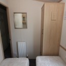 second view of the twin bedroom with central heating
