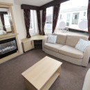 lounge with sofas and fire in the 2011 Swift Moselle