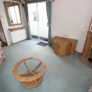 tv area by the doors in the 2002 Willerby Manor