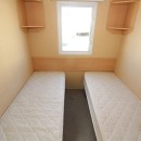 twin beds with cupboards
