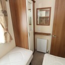 wardrobe and twin beds