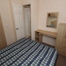 double bedroom with dressing table in the 2008 BK Contessa