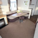 lounge with dining table in the 2013 Swift Burgundy