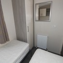 second view of twin bedroom