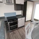 kitchen with oven to dining area in the 2015 Regal Henley