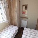 third bedroom with twin beds in the 2016 ABI Oakley