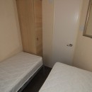 second view of twin bedroom