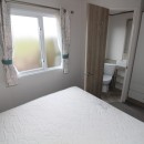 double bed by windows